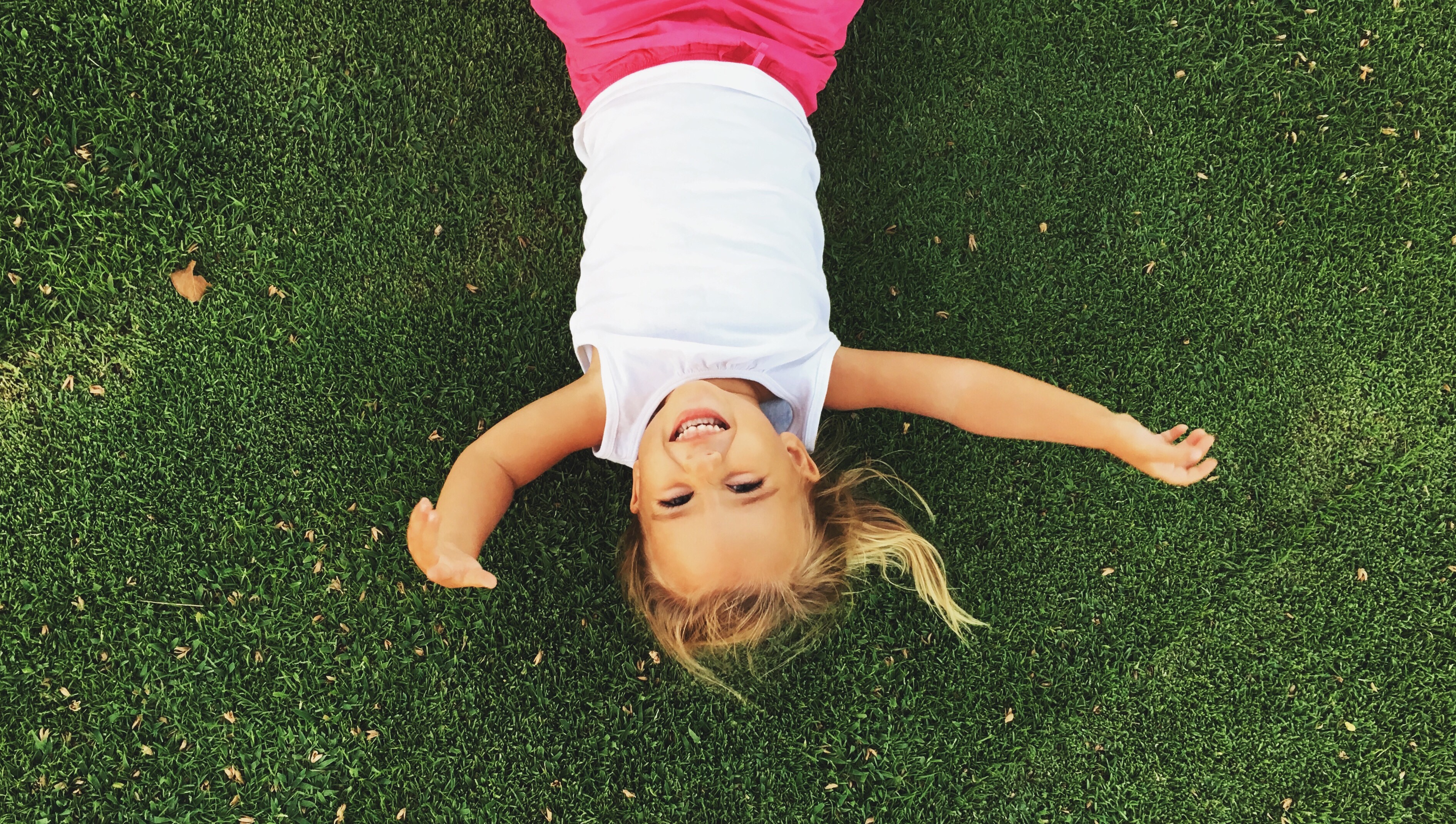 Happy Girl Laying On The Grass T20 A83rp9